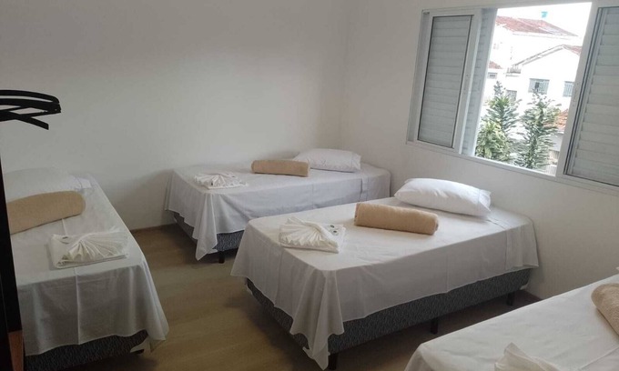 Paraisopolis Apartamento | Quarto Família Superior na Pousada Verissimus