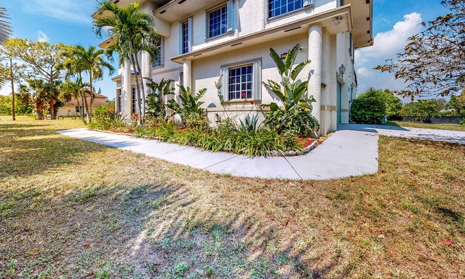 Loxahatchee Casa | Renovated, elegant retreat with a fitness room, work desks, large deck, & W/D