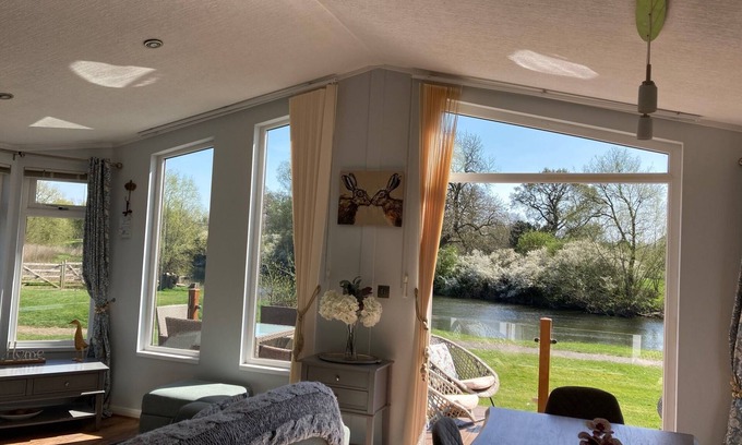 Tiddington Casa | River Retreat Lodge is front line with panoramic views over the river Avon.