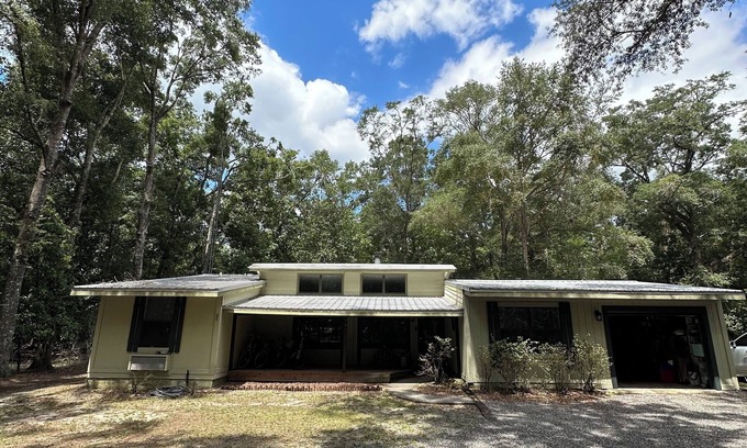 High Springs Casa | Riverfront Forest Retreat - Near Springs & UF! 3BR/2BA on the Santa Fe River!
