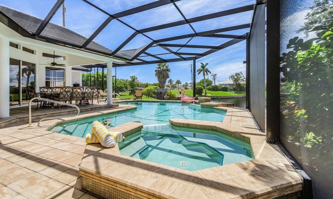 Pelican Casa | Riverfront Luxury with Heated Pool, Spa & Private Dock – Sunny Shores Escape