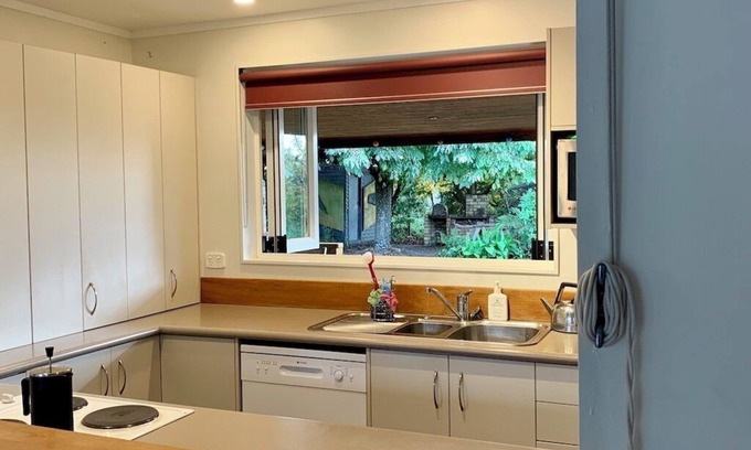 Broadlands Forest Casa | Riverside accommodation which is perfect for groups. Pizza oven, covered deck.