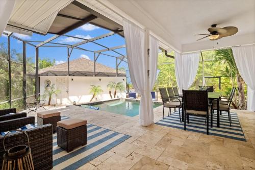 Palm Coast Casa | Romantic Beach Home with Heated Pool Golf Cart