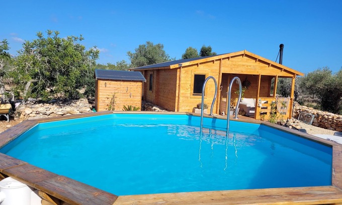 L'Ametlla de Mar Chalet De Esquí | Romantic chalet with private pool surrounded by olive trees.