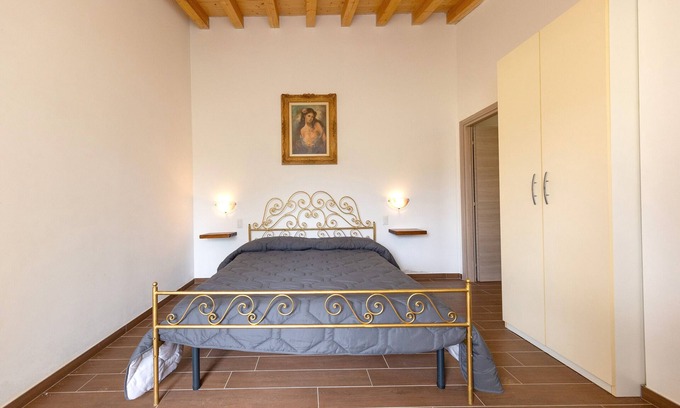 Massa Marittima Apartamento | Habitación 'Camera 1' con piscina compartida, jardín compartido y aire acondicionado.