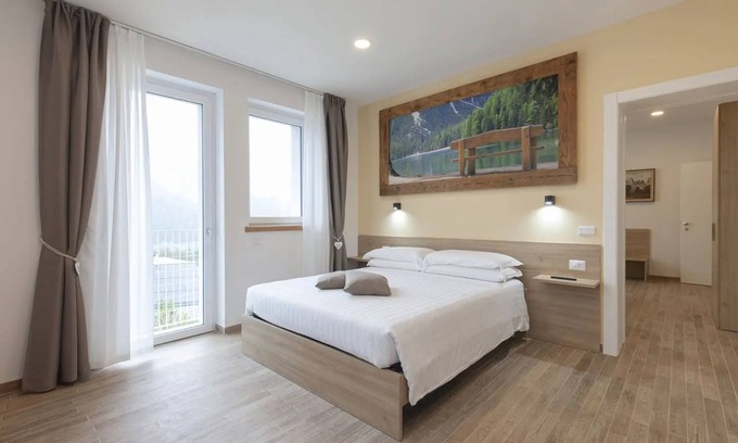 Domegge di Cadore Apartamento | Habitación 'Camera G Beige' con vistas al lago, terraza compartida y Wi-Fi