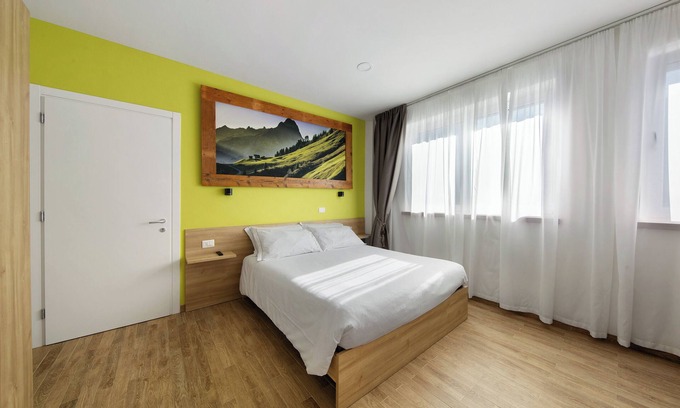 Domegge di Cadore Apartamento | Habitación 'Camera S Verde Bagno Esterno Privat' con vistas al lago, terraza compartida y Wi-Fi