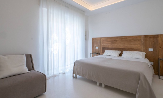 Porto Cesareo Apartamento | Habitación 'Valentino - 03' con terraza compartida, Wi-Fi y aire acondicionado