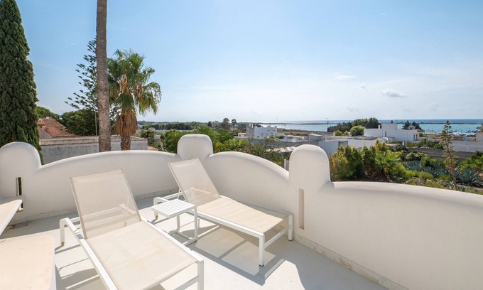 Porto Cesareo Apartamento | Habitación 'Valentino Luxury - 01' con vista al mar, Wi-Fi y aire acondicionado