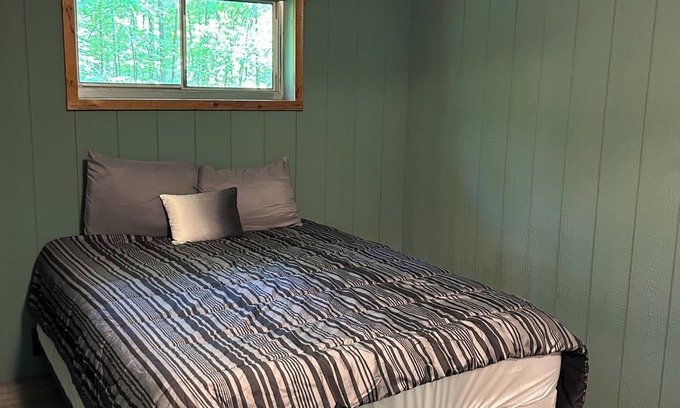 Palmyra Cabina | Rustic cabins in secluded campground with lake access and woods to wander in.