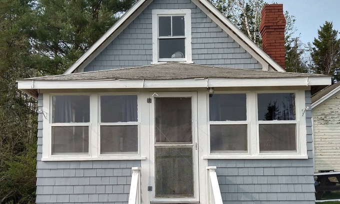 Dennysville Cabaña | Rustic, two-story, clapboard cottage, field view, Pet-friendly, Downeast Maine