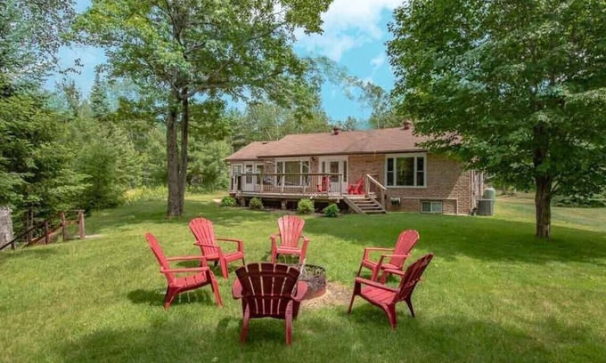 Kearney Cabaña | Sand Lake Getaway - Modern Riverfront Cottage w/ Swimming & Hot Tub