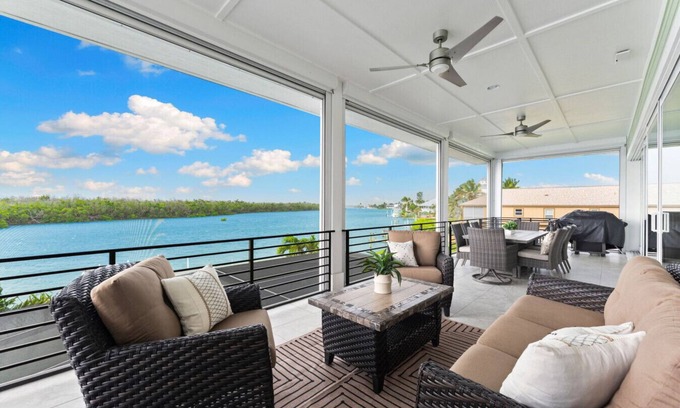 Bonita Springs Casa | Seafoam Serenity - Bayfront Retreat w/Dock, Pool & 1 Min Walk to Bonita Beach