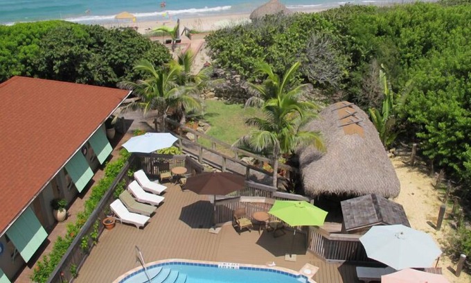 Melbourne Beach Condominio | Seashell Suites Resort-Oceanfront Lujo informal y privacidad.