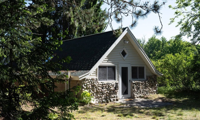 Burt Lake Cabaña | Secluded hideaway in the woods! Renovated, well appointed 1928 cottage