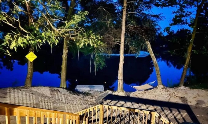 Denham Springs Casa | Secluded Riverside Oasis: Stunning Views, Private Dock, Beach Access & Adventure