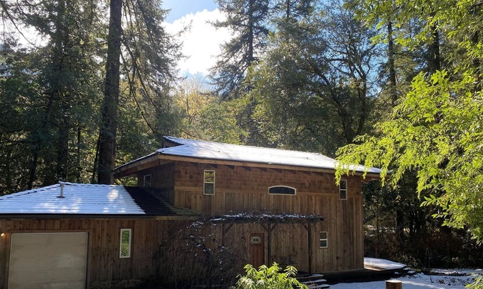 Coos Bay Casa | Serene Creekfront Lodge style home hidden away in Elliot National Forest