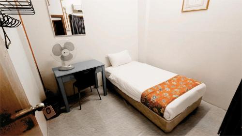 Bandar Melaka Casa | Single Bed Fan Room with Shared Bathroom