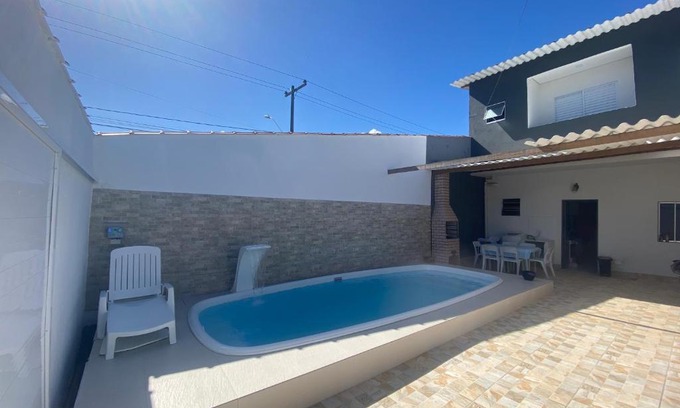 Jardim Virginia Casa | Sobrado com piscina e área gourmet na praia da Enseada