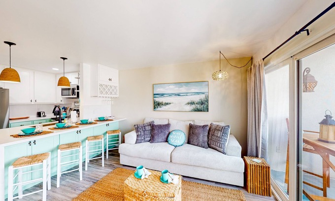 South Oceanside Condominio | Sound view condo with modern interior, gas fireplace, balcony, & W/D access