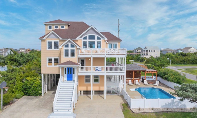 Wind Over Waves Casa | Soundside Dog Friendly Home w/ Pool, Hot Tub, Game Room, Tiki Bar, Public Dock