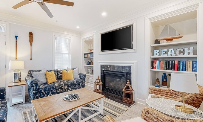 Sunset Island Casa | Spacious beachside home with fireplace, washer/dryer, pools, dock, & gym