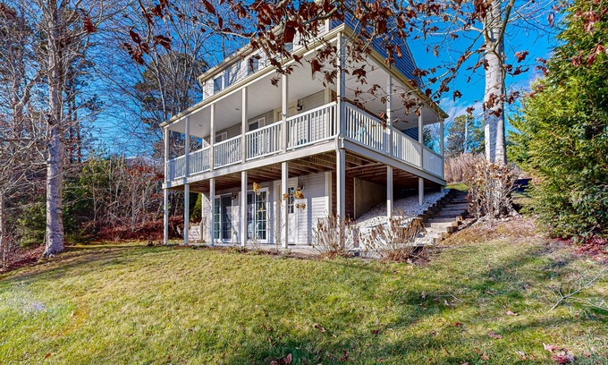 Mashpee Casa | Spacious home close to Peters Pond Beach with porch, AC, W/D, & water view