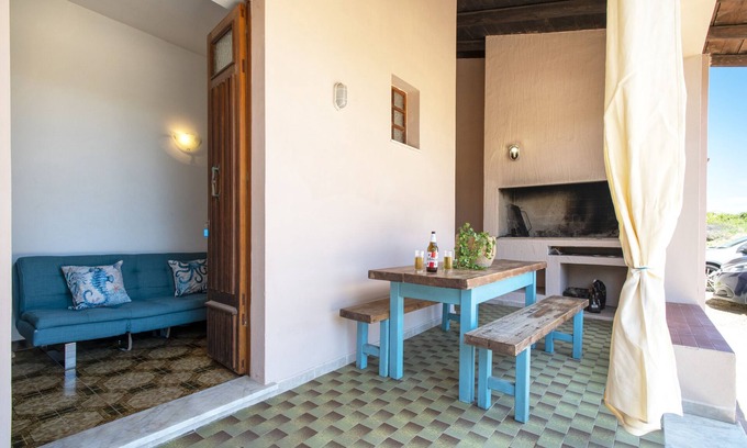 Paduledda Casa | Espaciosa casa en Costa Rossa con vista parcial al mar y terraza