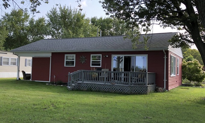 Coldwater Cabaña | Spectacular sunset views and north chain lake front red cottage rental