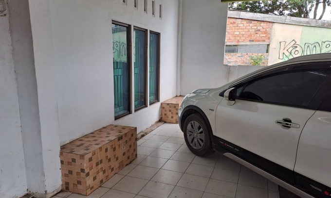 Jambi Hotel | SPOT ON 93464 Penginapan Tulimario Syariah