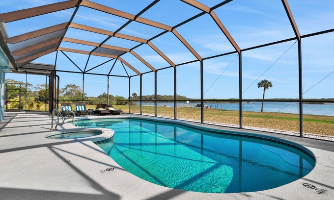Edgewater Casa | Sprawling intercoastal home with boat lifts, pool and hot tub