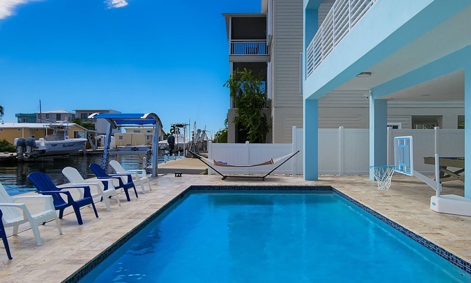 Key Largo Casa | Sprawling waterfront home with pool, outdoor kitchen, game table, grill, & W/D