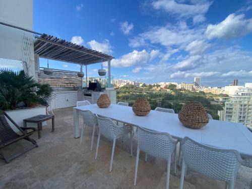 Il-Balluta Apartamento | St Julians Luxurious Penthouse with POOL Enjoying Distant SEAVIEWS