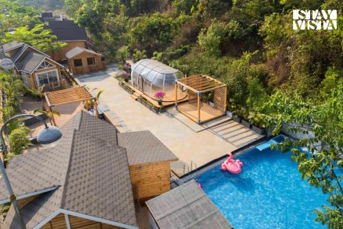 Morjim Villa | StayVista at Woodhouse Story with Pool, WiFi, AC