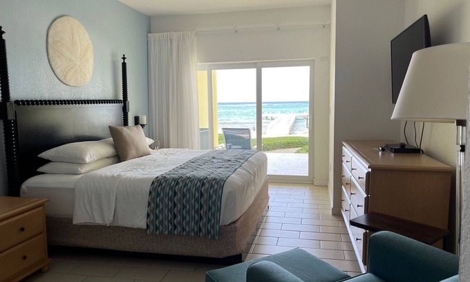 Colliers Bay Complejo | Step onto beach! Beach front 2 bed + bath condo with full kitchen, LR/DR, patio