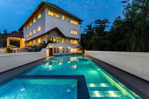Chirayinkil Hotel | Still Waters Alaya Stays by ELIVAAS