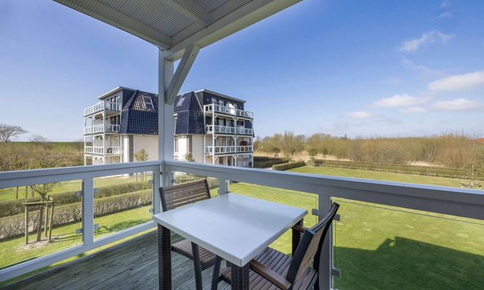 Wremen Apartamento | Strandnahe, Hundefreundliche Ferienwohnung mit Sauna und Balkon mit Strandkorb