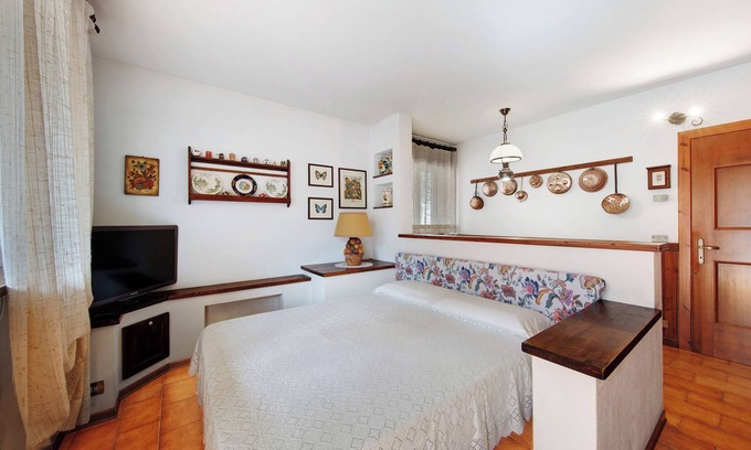 Domegge di Cadore Apartamento | Estudio 'Monolocale Monti Pallidi' con vistas a la montaña, terraza privada y jardín compartido