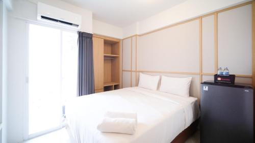 Sidoarjo Apartamento | Studio Apartment at Suncity Residence Sidoarjo near Suncity Mall By Travelio