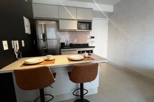 Picanco Apartamento | Studio Cidade Maia equipado 13