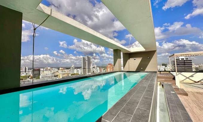 Yolanda Morales Condominio | Stunning City Center Condo Full AC, Pool, Near All