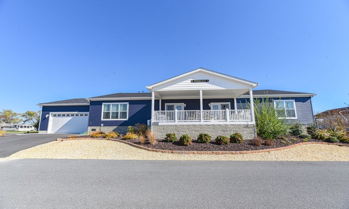 Long Neck Casa | Stunning waterfront home, beach, pools, pet friendly!