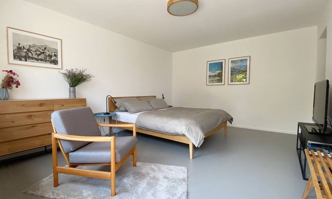 Wolfratshausen Apartamento | Apartamento moderno con linda cabaña y jardín