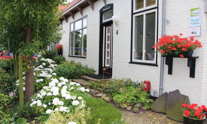 De Waal Casa | Elegante apartamento con jardín en una antigua granja en De Waal