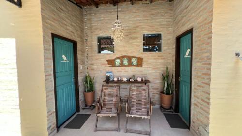 Cumuruxatiba Casa | Suítes Curió - Passarim Hospedagem