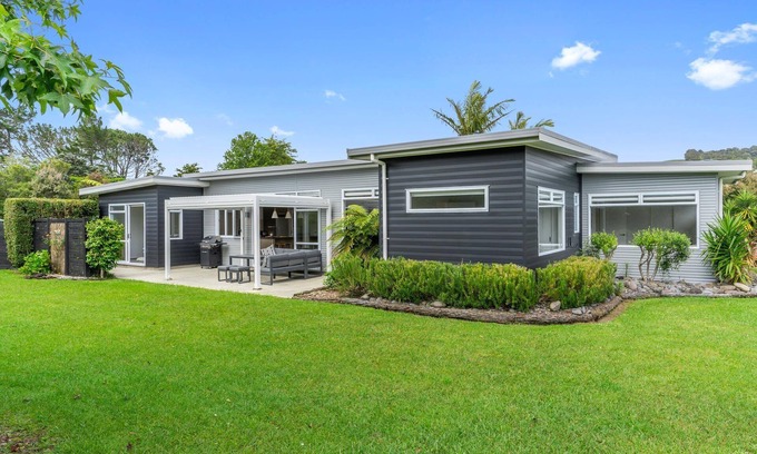 Mangawhai Casa | Sun Central - Modern, sunny holiday home in tranquil garden setting