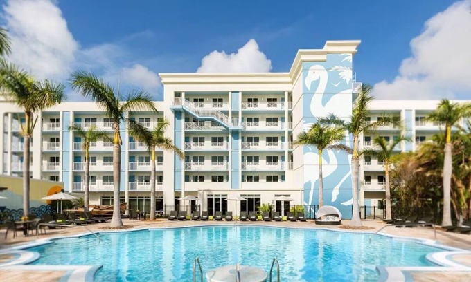 New Town Hotel | Sun, Sip, & Socialize | Island Stay w/ 2 Pools & Backyard Bash
