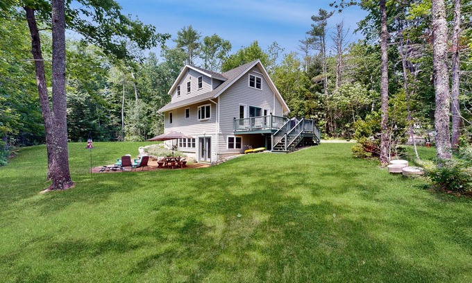 Warren Casa | Sunny, lakefront home on South Pond with private dock, great deck & firepit