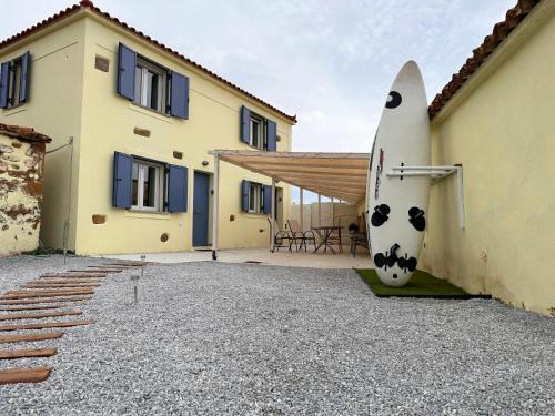 Lemnos Casa | Surf-themed stone house at Kalliopi