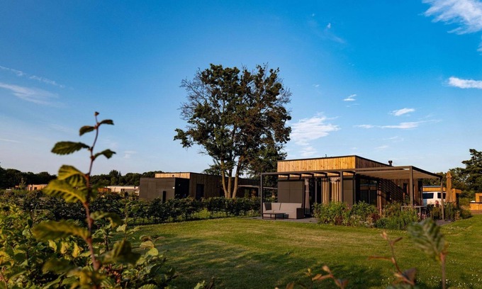 Kotten Casa | The Amalia is a 4-person holiday home with a cozy and homely living room with an open kitchen, 2 bedrooms, and a spacious outdoor area.